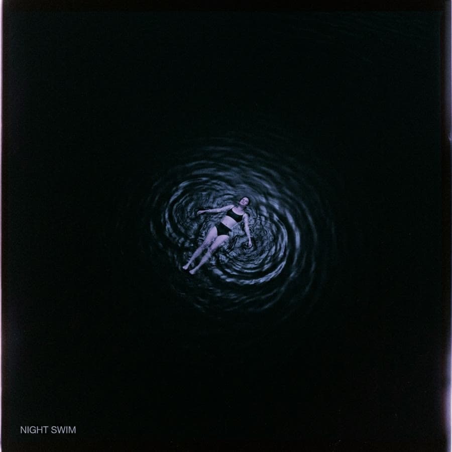 Cover art concept: Night Swim, a figure floating in dark water seen from above